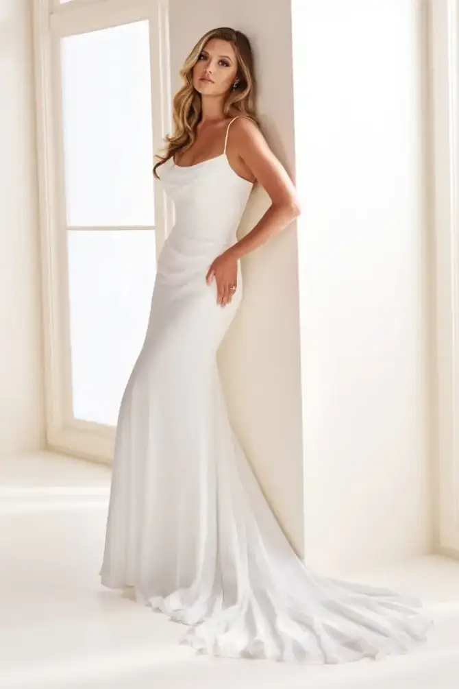 model is wearing a sleeveless cowl neck satin wedding dress