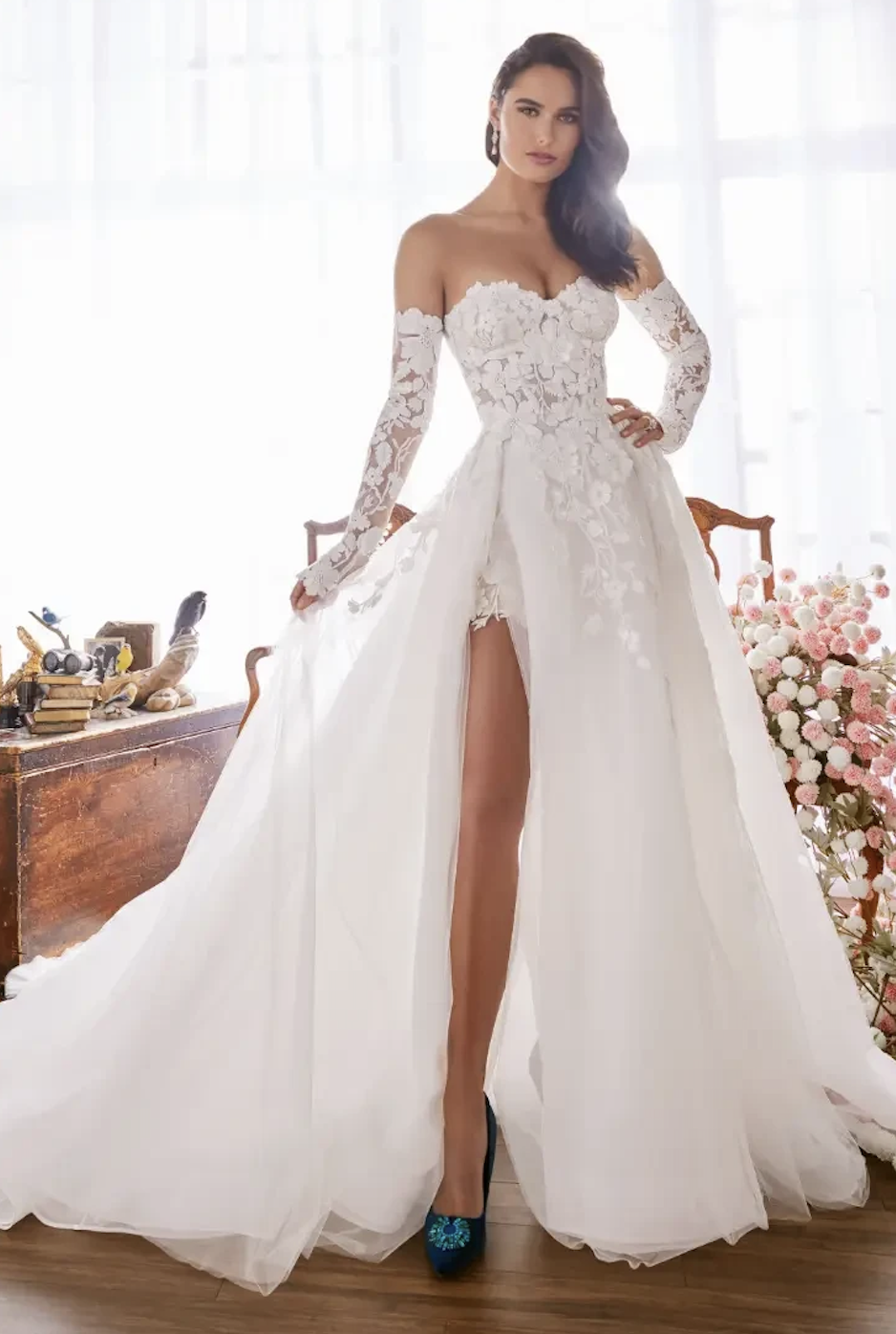 model is wearing a lace a-line wedding dress