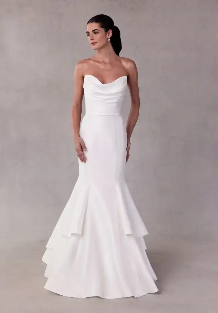 model is wearing a strapless fit and flare wedding gown